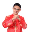 Happy Chinese new year.Young Asian man with gesture of congratulation Royalty Free Stock Photo