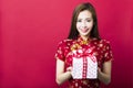 Happy chinese new year.young woman holding gift box Royalty Free Stock Photo