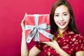 Happy chinese new year.young woman holding gift box Royalty Free Stock Photo