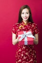 Happy chinese new year.young woman holding gift box Royalty Free Stock Photo