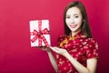 Happy chinese new year.young woman holding gift box Royalty Free Stock Photo