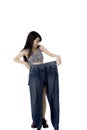 Happy Chinese woman holds old jeans Royalty Free Stock Photo