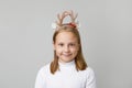 Happy Christmas child girl in hairdeco smiling on white background Royalty Free Stock Photo