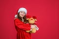 happy christmas child girl wear red santa claus hat and costume play with reindeer toy, toy shop Royalty Free Stock Photo