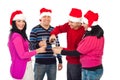 Happy Christmas friends pouring champagne Royalty Free Stock Photo