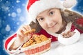 Happy Christmas girl eating Christmas cookies Royalty Free Stock Photo