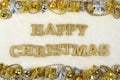 Happy christmas golden text and Christmas decorations on a white Royalty Free Stock Photo