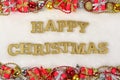 Happy Christmas golden text and Christmas decorations on a white Royalty Free Stock Photo