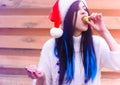 Happy Christmas holidays, girl eat sweets