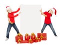 Happy Christmas kids holding banner. Santa helpers with poster Royalty Free Stock Photo