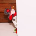 Happy Christmas snowman. Christmas decoration on a wooden background. Greeting card. Xmas decoration. Royalty Free Stock Photo