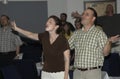 Happy church goers in worship and praise