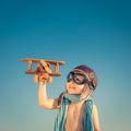 Happy cild playing with vintage airplane outdoor Royalty Free Stock Photo