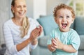 Happy, clapping hands and mother and son playing in the living room of their family home. Happiness, love and energy of Royalty Free Stock Photo