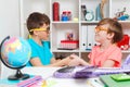 Happy classmates doing handshake. School kids learning together at class Royalty Free Stock Photo