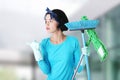 Happy cleaning woman showing copy space. Royalty Free Stock Photo