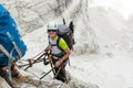 Happy climber reaching the summit of ladder.