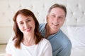 Happy closeup people faces. Smiling middle age couple at home. Family fun time weekend and strong love relationship. Healthy smile Royalty Free Stock Photo