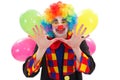Happy clown with balloons, gesturing with hand