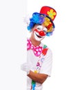 Happy clown holding the blank board Royalty Free Stock Photo