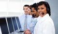Happy co-workers with headsets on in call center Royalty Free Stock Photo