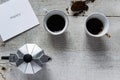 Top view of two coffee cups, italian coffee maker-moka and white card with `Happy` text Royalty Free Stock Photo