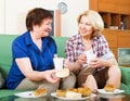 happy colleagues drinking coffe and talking during pause for lunch Royalty Free Stock Photo