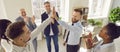 Happy colleagues giving high five at meeting at office, celebrating success or business achievement Royalty Free Stock Photo