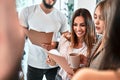 Happy colleagues have fun at lunch break in office, smiling employees laugh and talk and drinking coffee Royalty Free Stock Photo