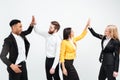 Happy colleagues in office gives a high-five to each other. Royalty Free Stock Photo