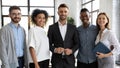 Group portrait of happy, smiling coworkers in modern light office