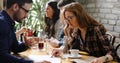 Happy colleagues from work socializing in restaurant Royalty Free Stock Photo