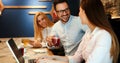 Happy colleagues from work socializing in restaurant Royalty Free Stock Photo