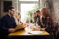 Happy colleagues from work socializing in restaurant Royalty Free Stock Photo