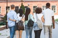 Happy College Friends Walking In Campus And Smiling To Camera Royalty Free Stock Photo