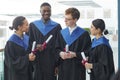 Happy college graduates chatting Royalty Free Stock Photo