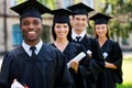 Happy college graduates. Royalty Free Stock Photo