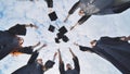 Happy college graduates tossing their caps up at sunset. Royalty Free Stock Photo