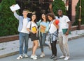 Happy College Years. Portrait of happy international students posing together outdoors