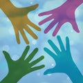 Happy colorful hands on a cloudy background