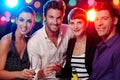 Happy companionship in discotheque Royalty Free Stock Photo