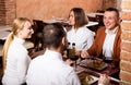 Company of friends eating delicious dinner Royalty Free Stock Photo