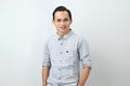happy confident asian indonesian man on isolated background