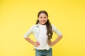 Happy confident child keep hands on hips. Cheerful and confident. Little girl cute smile. Casual look and fashion. Feel Royalty Free Stock Photo