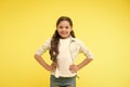 Happy confident child keep hands on hips. Cheerful and confident. Little girl cute smile. Casual look and fashion. Feel Royalty Free Stock Photo