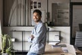 Happy confident handsome young Indian business man posing in office Royalty Free Stock Photo