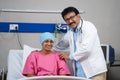 Happy confident indian doctor with recovered cancer patient looking camera at hospital - concept of successful treatment Royalty Free Stock Photo