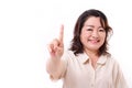 Happy, confident middle aged woman pointing up one finger Royalty Free Stock Photo