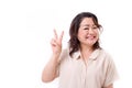 Happy, confident middle aged woman pointing up v sign, victory