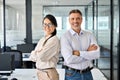 Happy diverse professional business man and business woman in office, portrait. Royalty Free Stock Photo